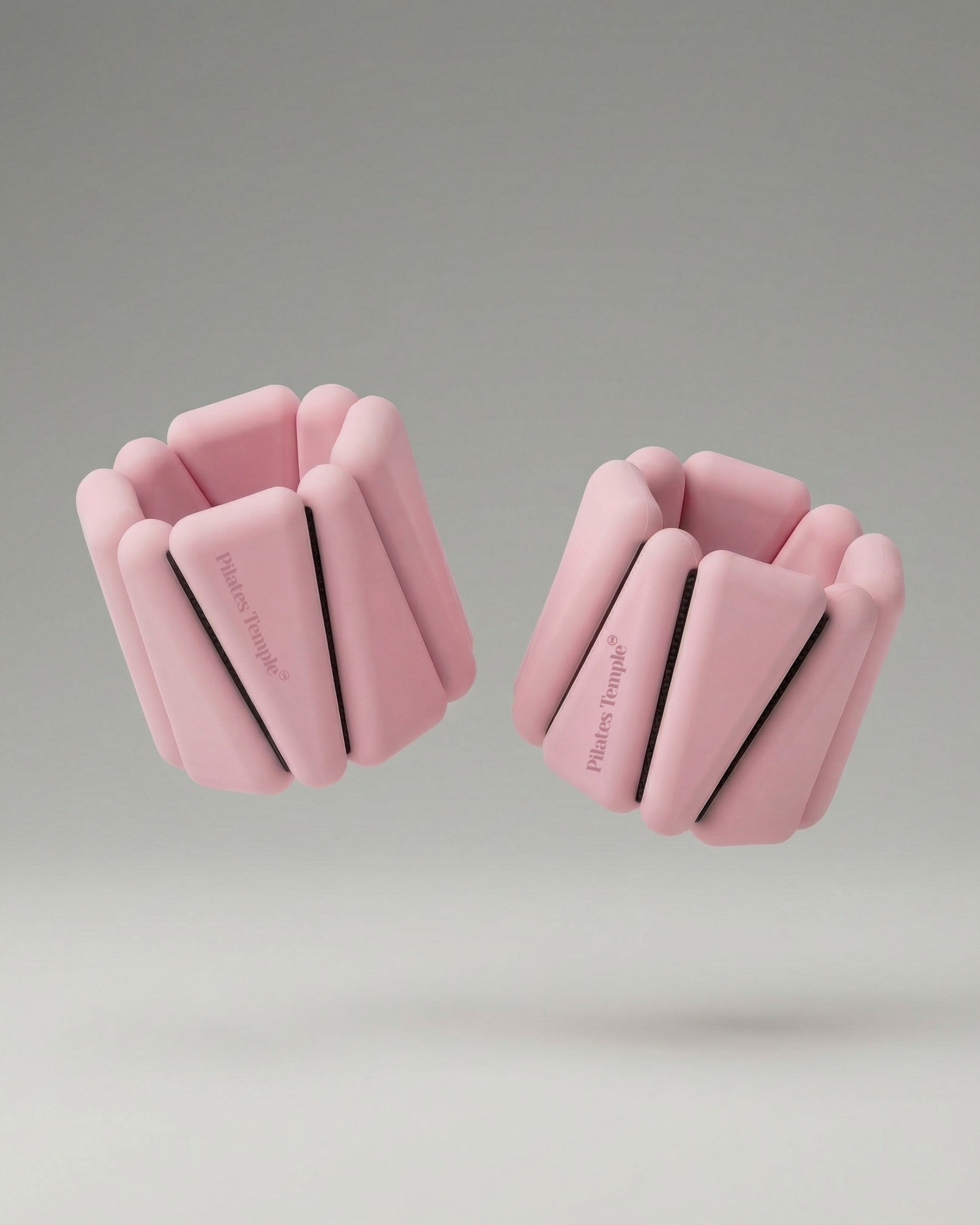 #color-Rose Paire de bracelets lestés ajustables Pilates Temple couleur rose.