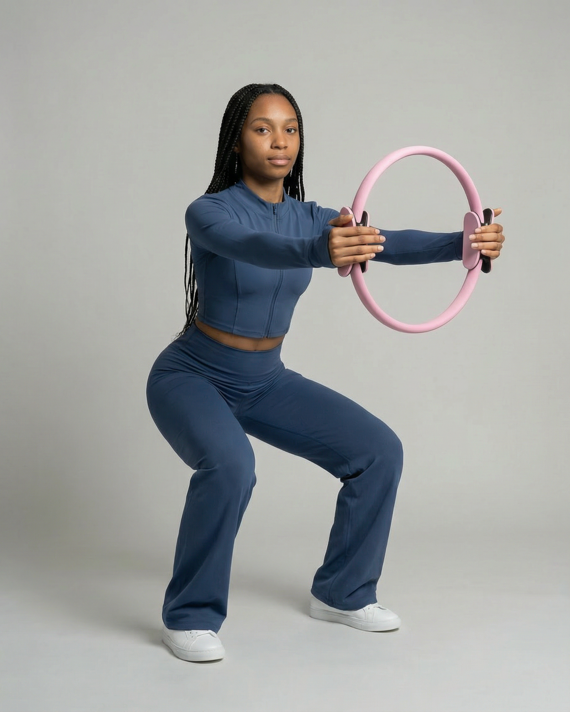 #color-Rose Exercice de renforcement des jambes avec le ring Pilates rose.