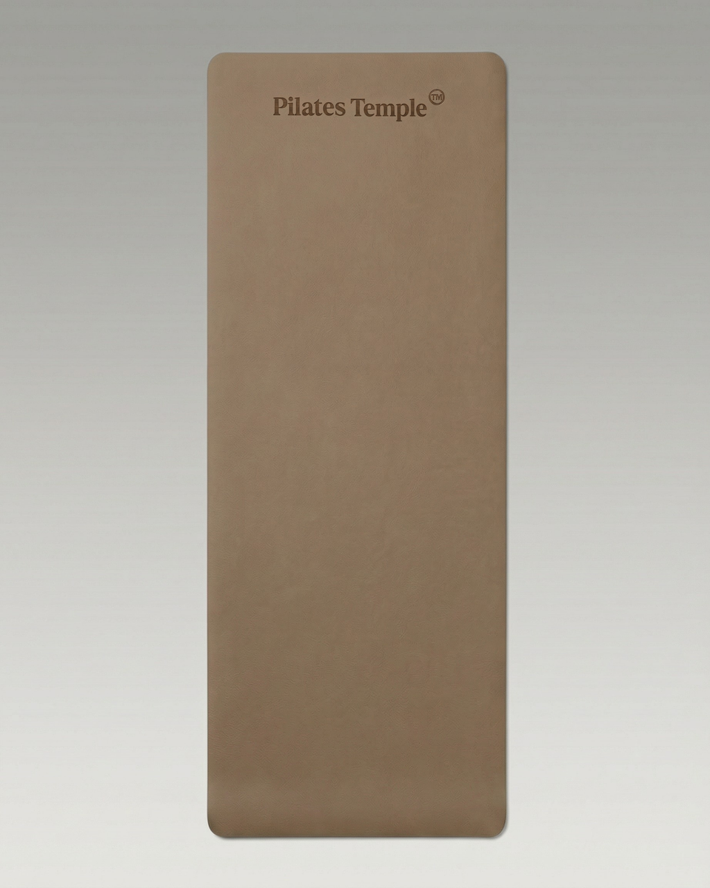 #color-Brun Tapis de Pilates antidérapant déroulé au sol.