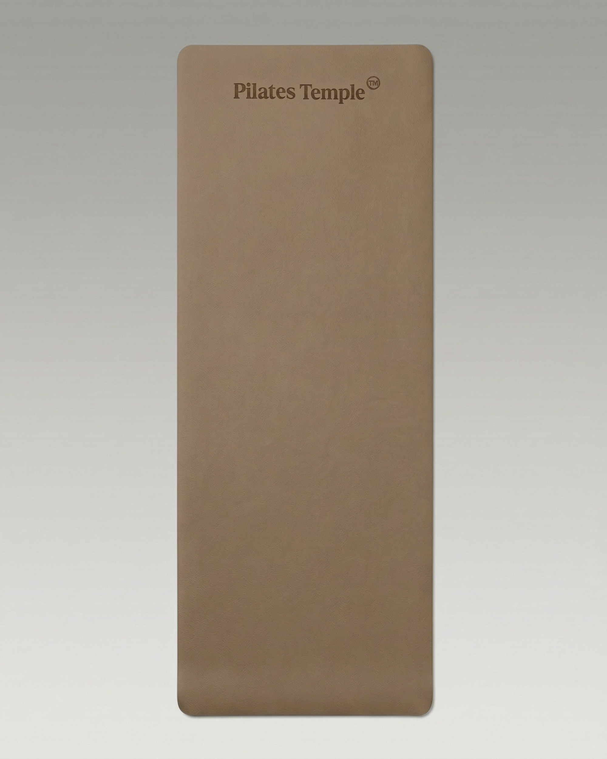 #color-Brun Tapis de Pilates antidérapant déroulé au sol.